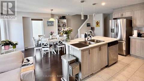 A modern kitchen with a dining table set up.