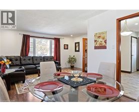 A dining room with a glass table and chairs.