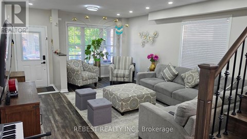 A living room with a piano and a couch.