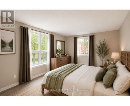 A bedroom with a bed, nightstands, and a window with curtains.