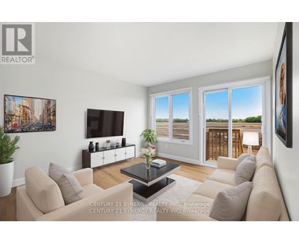 A living room with a couch, a coffee table, and a television.