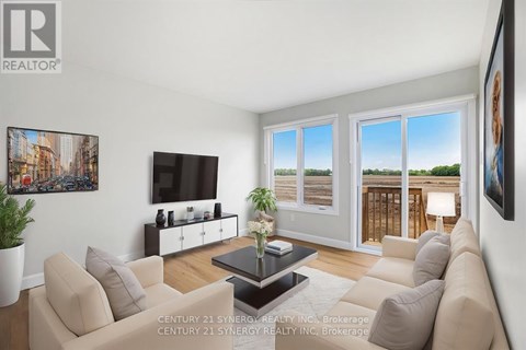 A living room with a couch, a coffee table, and a television.