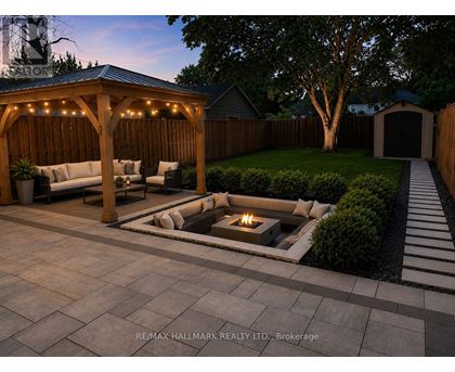 A backyard with a fire pit and seating area.