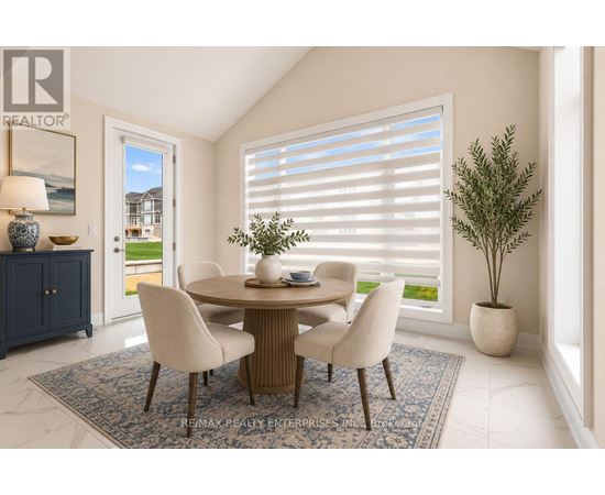 A dining room with a table and chairs.