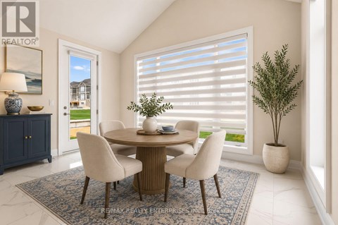 A dining room with a table and chairs.