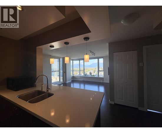 A kitchen with a sink and a window.