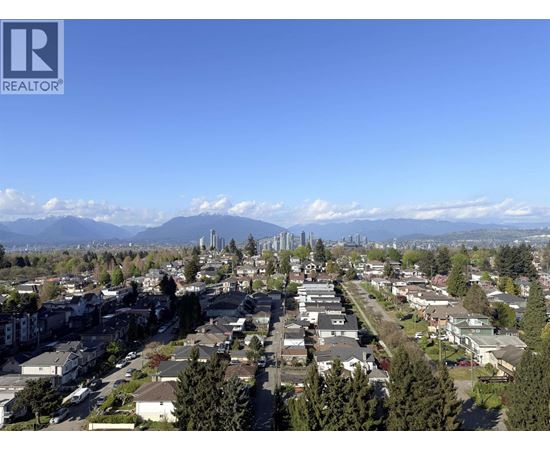A realtor logo is on the corner of a picture of a neighborhood.