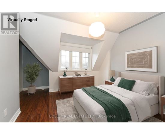 A bedroom with a bed, nightstand, and lamp.