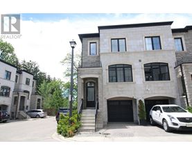 A large house with a car parked in front.