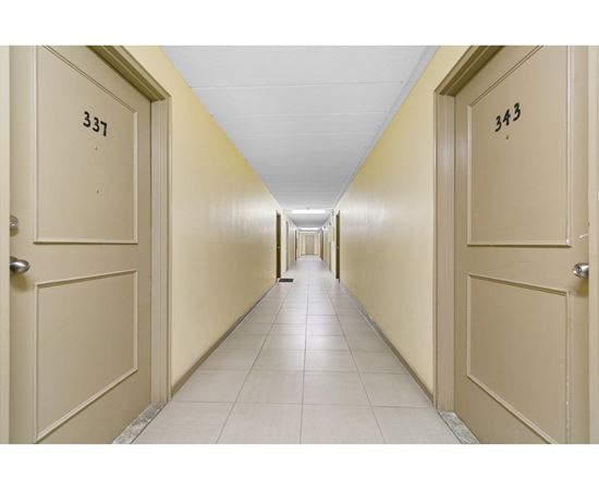 A long hallway with doors numbered 337 and 343.