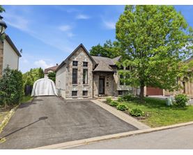 A house with a driveway and a garage door.