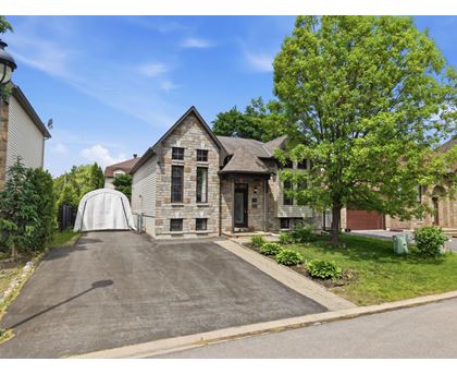 A house with a driveway and a garage door.