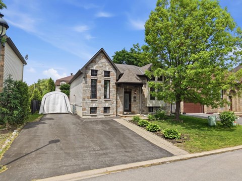 A house with a driveway and a garage door.