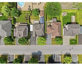 A suburban neighborhood with houses and a pool.