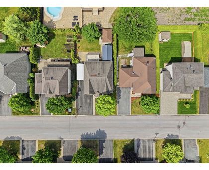 A suburban neighborhood with houses and a pool.