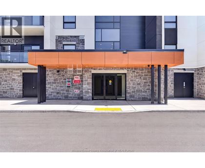 The front of a building with a black door and a sign that says REALTOR.