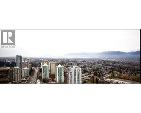 A cityscape with a realtor logo in the corner.