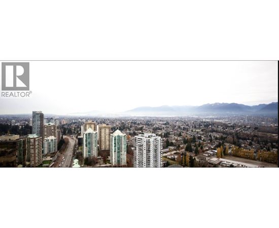 A cityscape with a realtor logo in the corner.