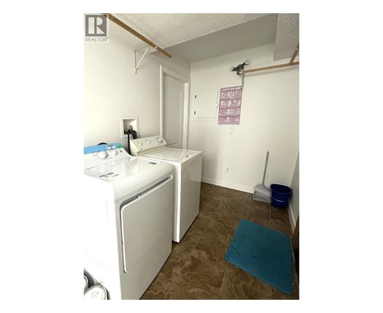 A laundry room with a washer and dryer.