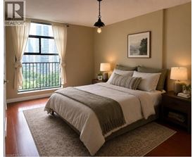 A bedroom with a large bed and a window with curtains.