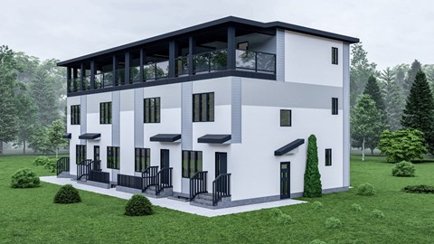 A modern two-story house with a balcony on the second floor.
