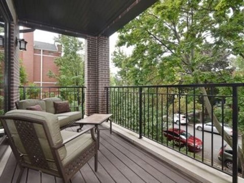 A patio with a chair and a table.