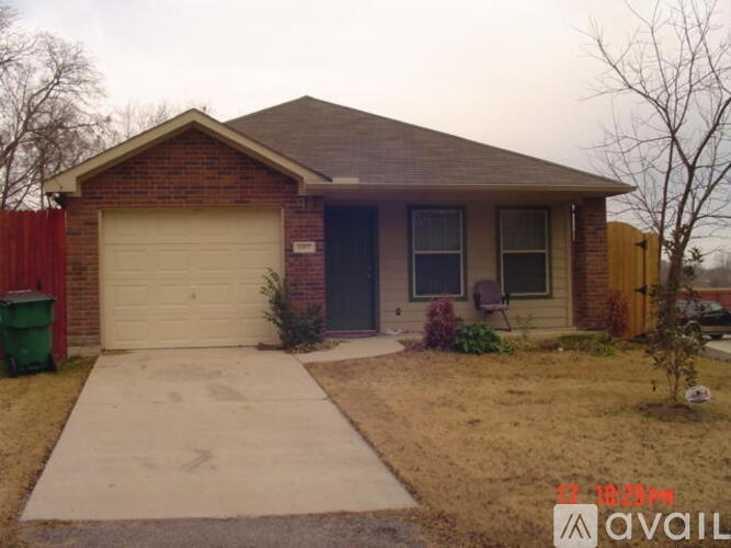 A house with a garage and a driveway.