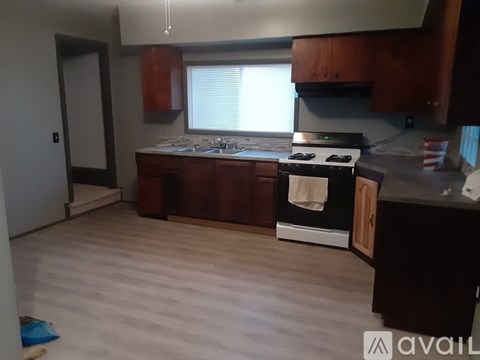 A kitchen with a stove and cabinets.