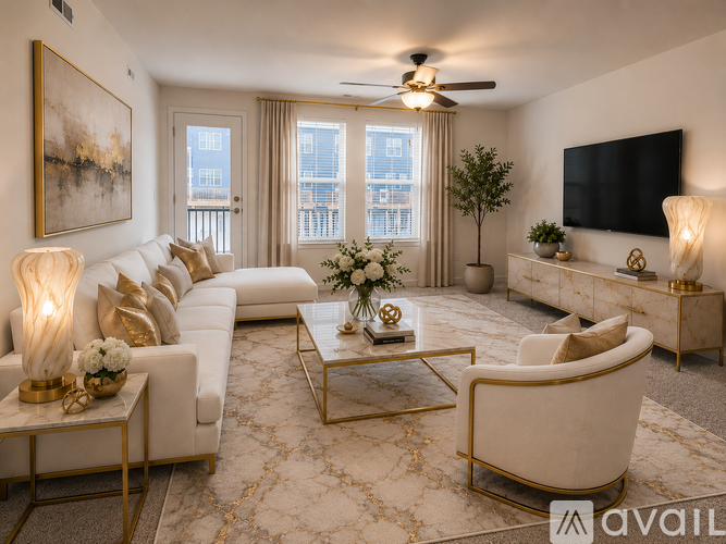 A living room with a white sofa, gold side tables, and a large painting on the wall.