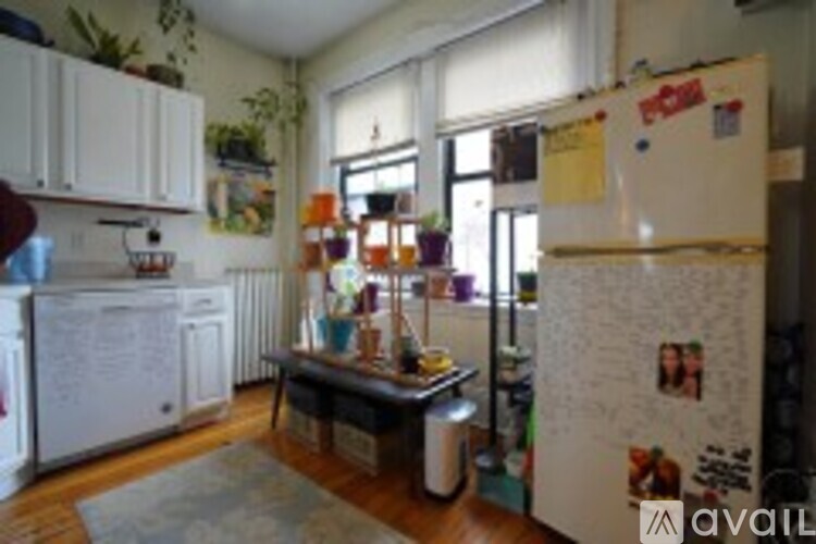 A kitchen with a white fridge and a white oven.
