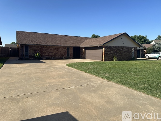 A house with a driveway in front of it.