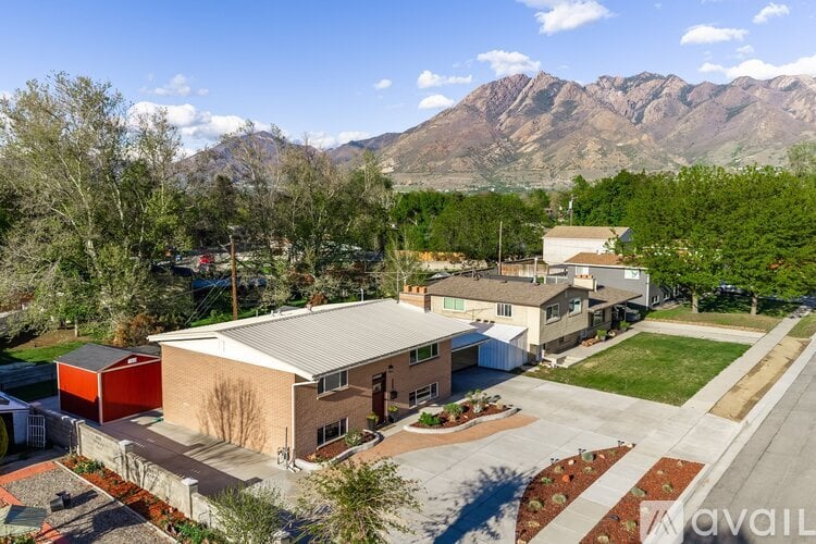 A house with a mountain in the background.