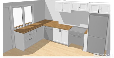 A kitchen with white cabinets and a wooden countertop.