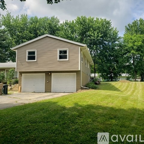 A two-car garage is attached to a house.