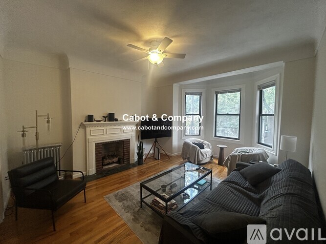 A living room with a fireplace and a couch.