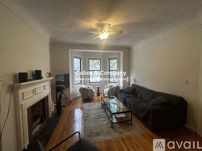 A living room with a fireplace and a couch.