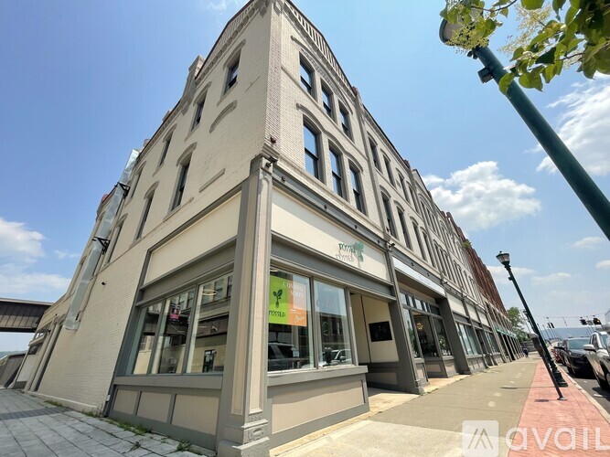 A building with a sign that says "AVAILABLE" on the front.