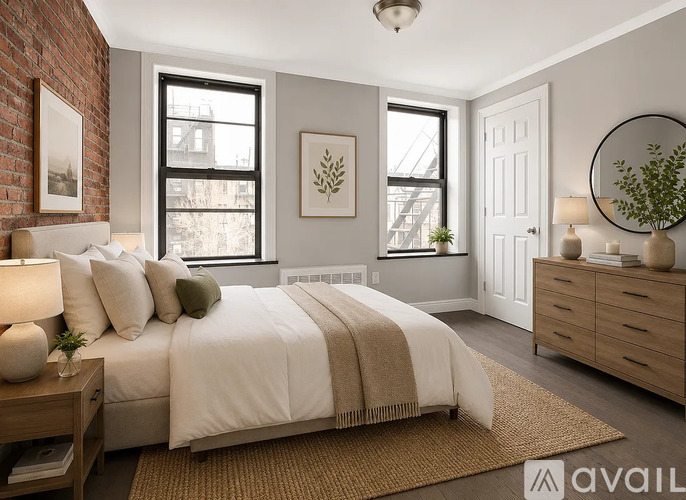 A bedroom with a bed, nightstand, and a plant on the dresser.