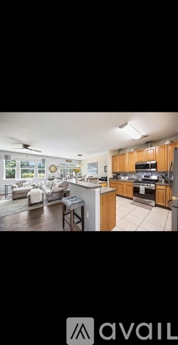 A kitchen with wooden cabinets and a white countertop.