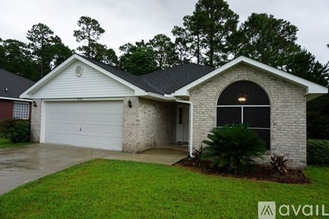 A house with a garage and a driveway.