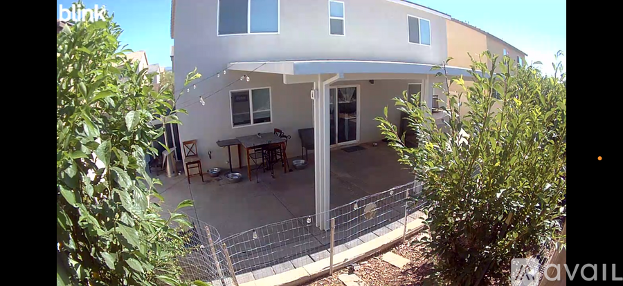 A house with a patio and a fence.