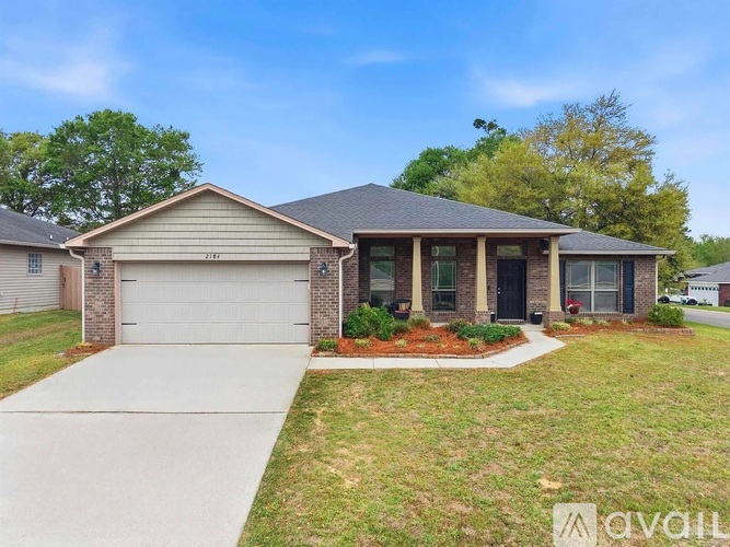 A house with a garage is for sale.