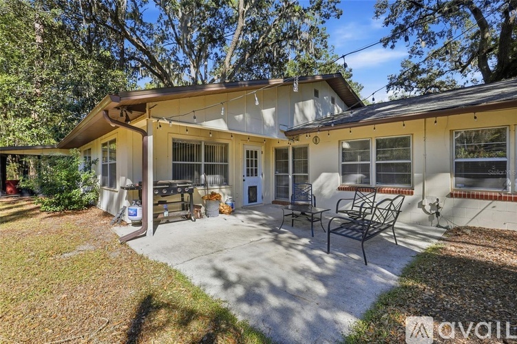 A house with a patio and a covered entrance.