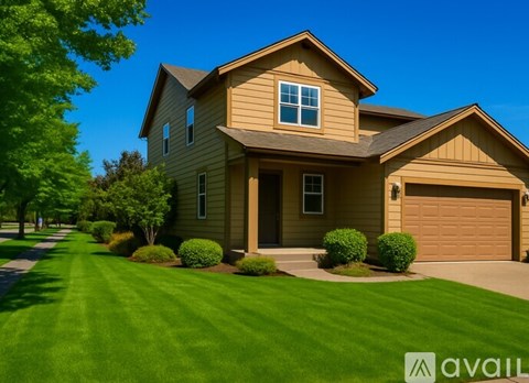 A house with a brown garage door is for sale.