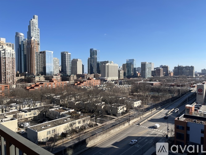 A cityscape with tall buildings and a clear sky.
