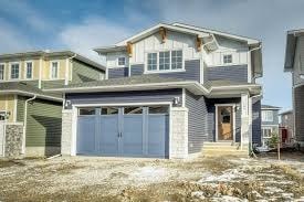 A two-story house with a garage is shown.