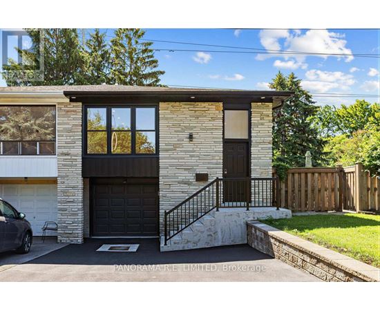 A house with a garage and a car parked in front.