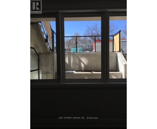 A window with a view of a playground outside.