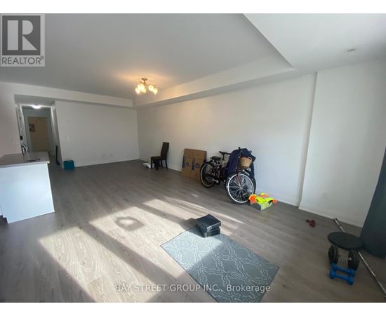 A room with a wooden floor and a bicycle in it.