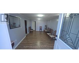 A long hallway with chairs on either side.